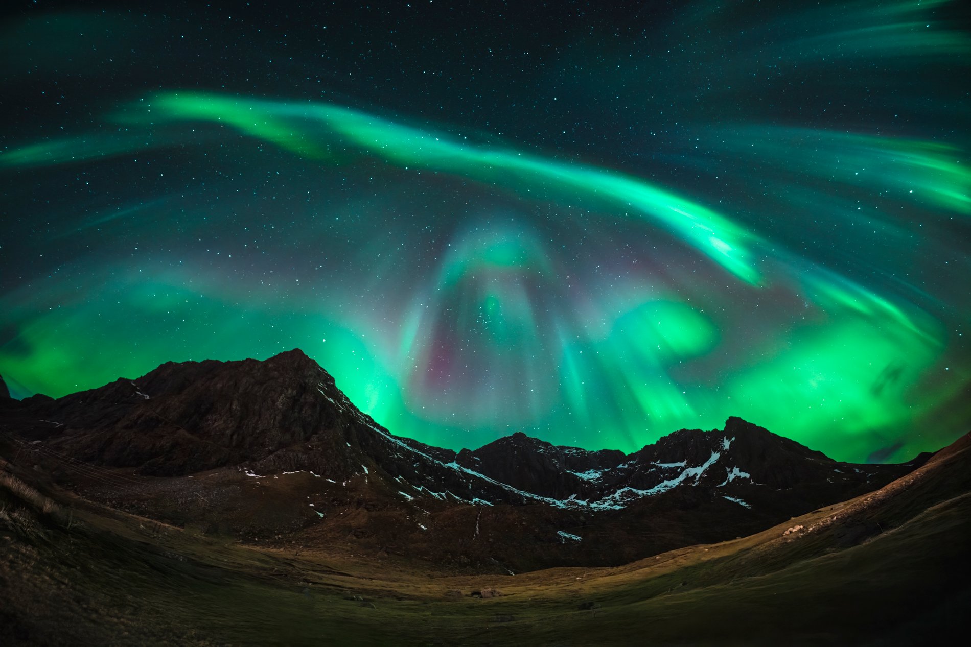 Aurora above mountains for the EARTH season